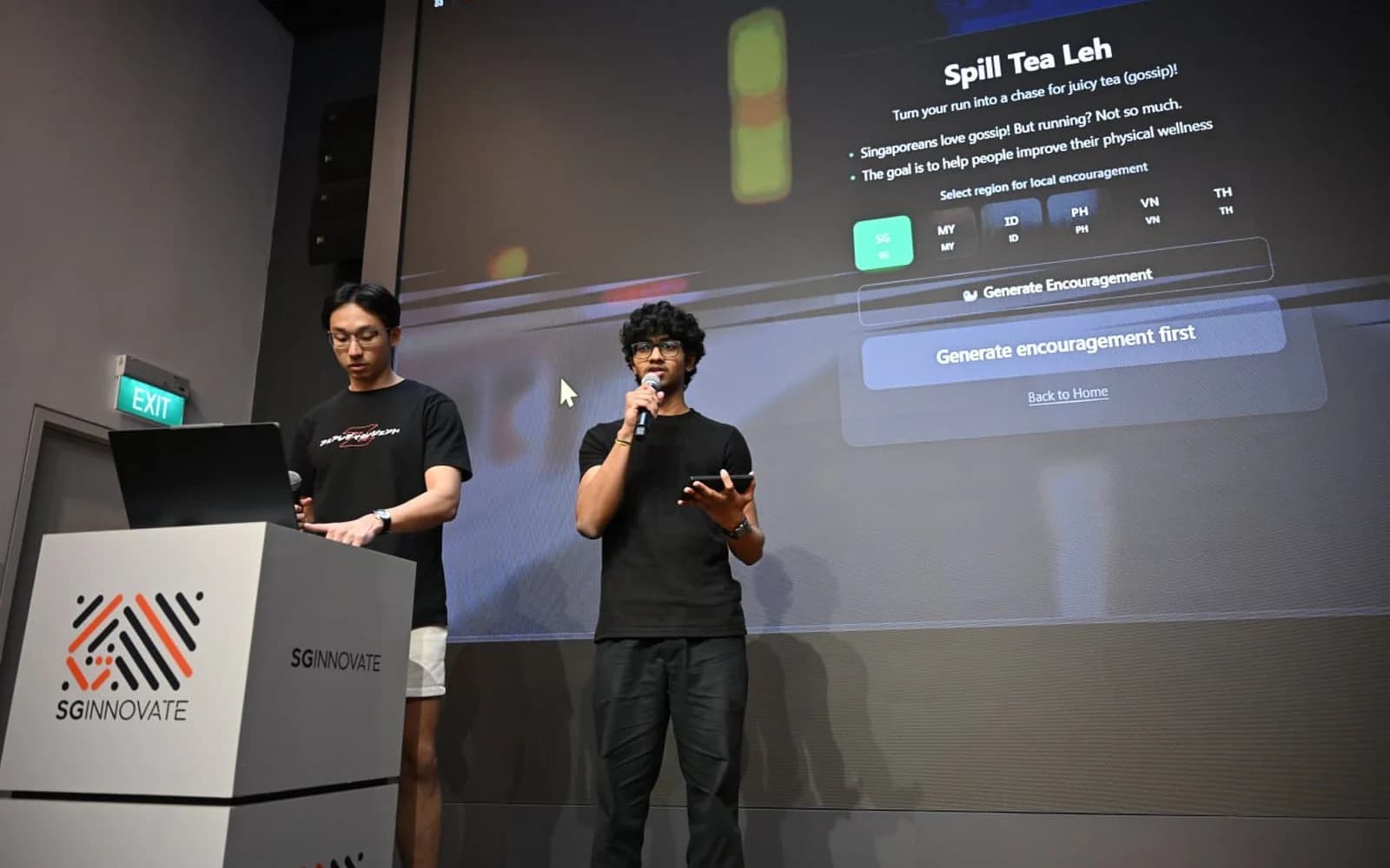 Abhishek pitching SpillTeaLeh on stage at Build for Impact